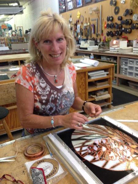 Renee applying copperfoil to a panel.jpg