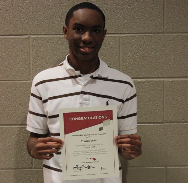 Smith holding his Gates-Millennium Scholarship Award at Lee High School