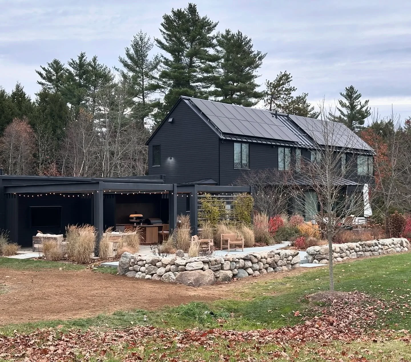 Rough walls meet clean lines. We built this wall to match the hundreds of feet of farm walling we are continuing to rebuild and used bluestone treads to match the bluestone seen at the front entry. #mainestonescapes #drystone #drystonewalling #farmwa