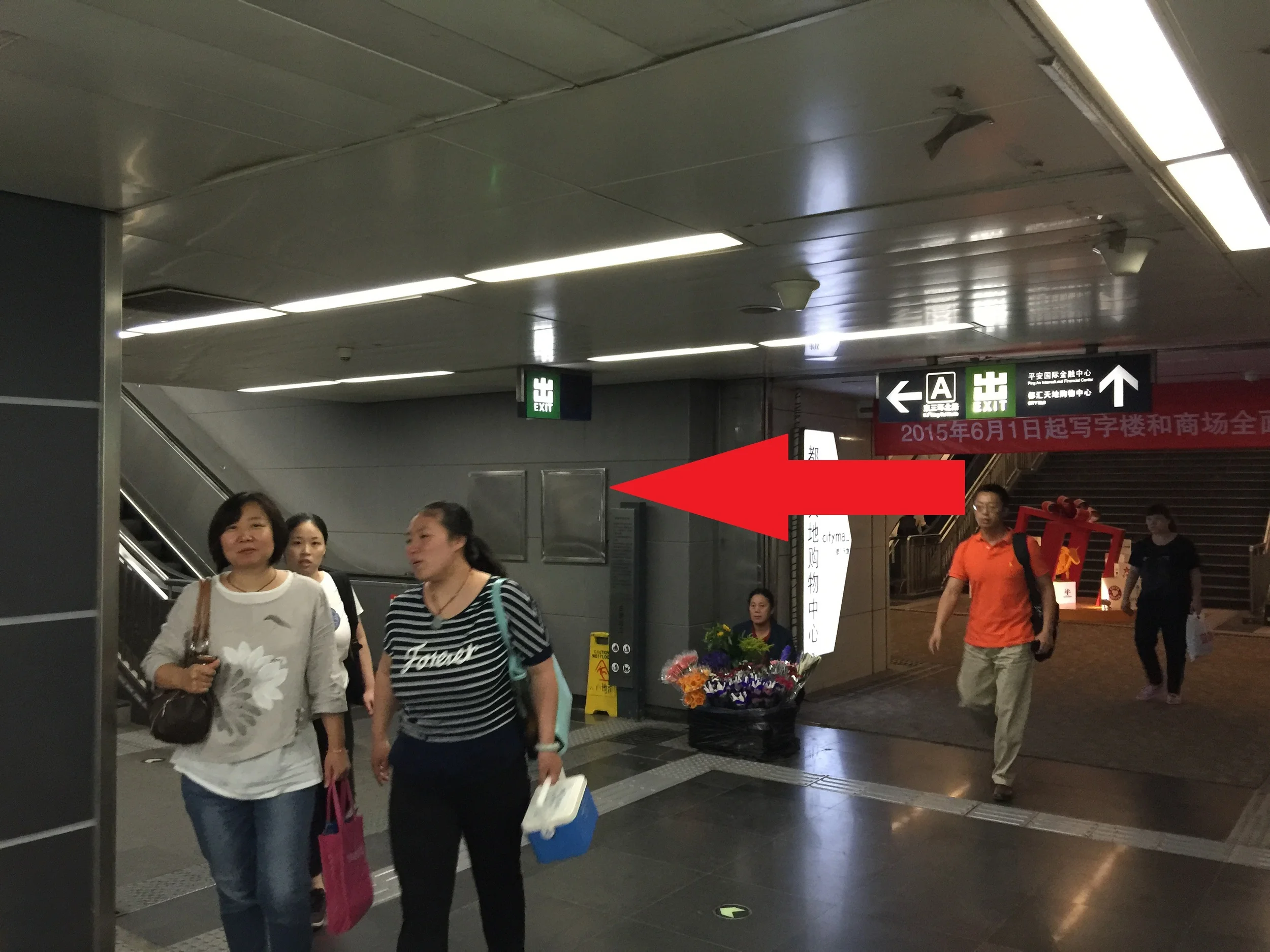 2. Follow the hallway until you come to the escalator on your left. 