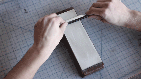 Sharpening a straight razor using X-pattern honing strokes.