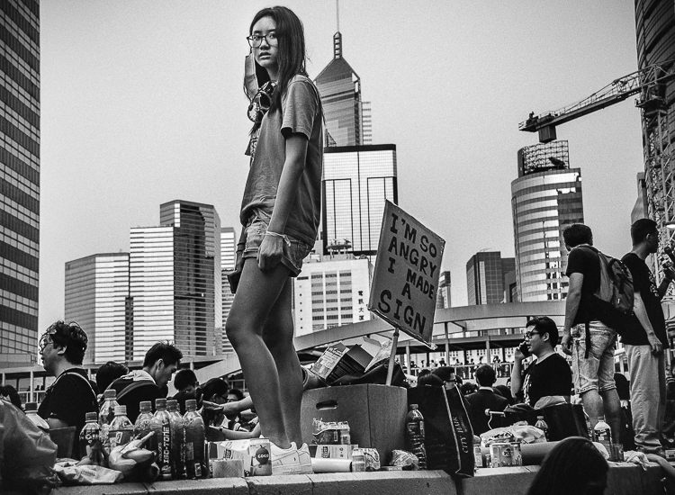 (c) Harriet Dedman 2015. Photograph of Isabelle Cheung, 18, at the Admiralty Protest Sites on 28 September 2014.