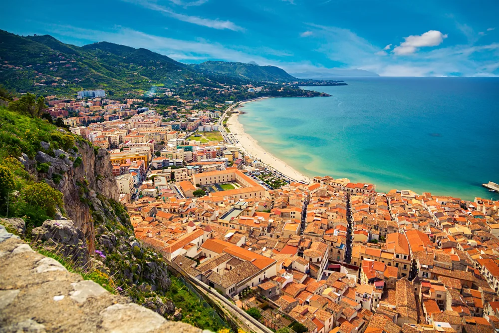 Upper-view-of-bright-orange-roofs-near-the-sea-in-Cefalu-Sicily-Italy_287341241.jpg