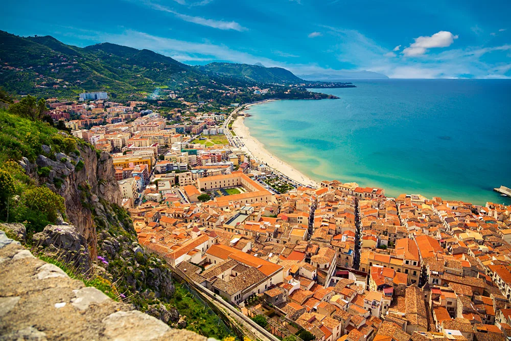 Upper-view-of-bright-orange-roofs-near-the-sea-in-Cefalu-Sicily-Italy_287341241.jpg
