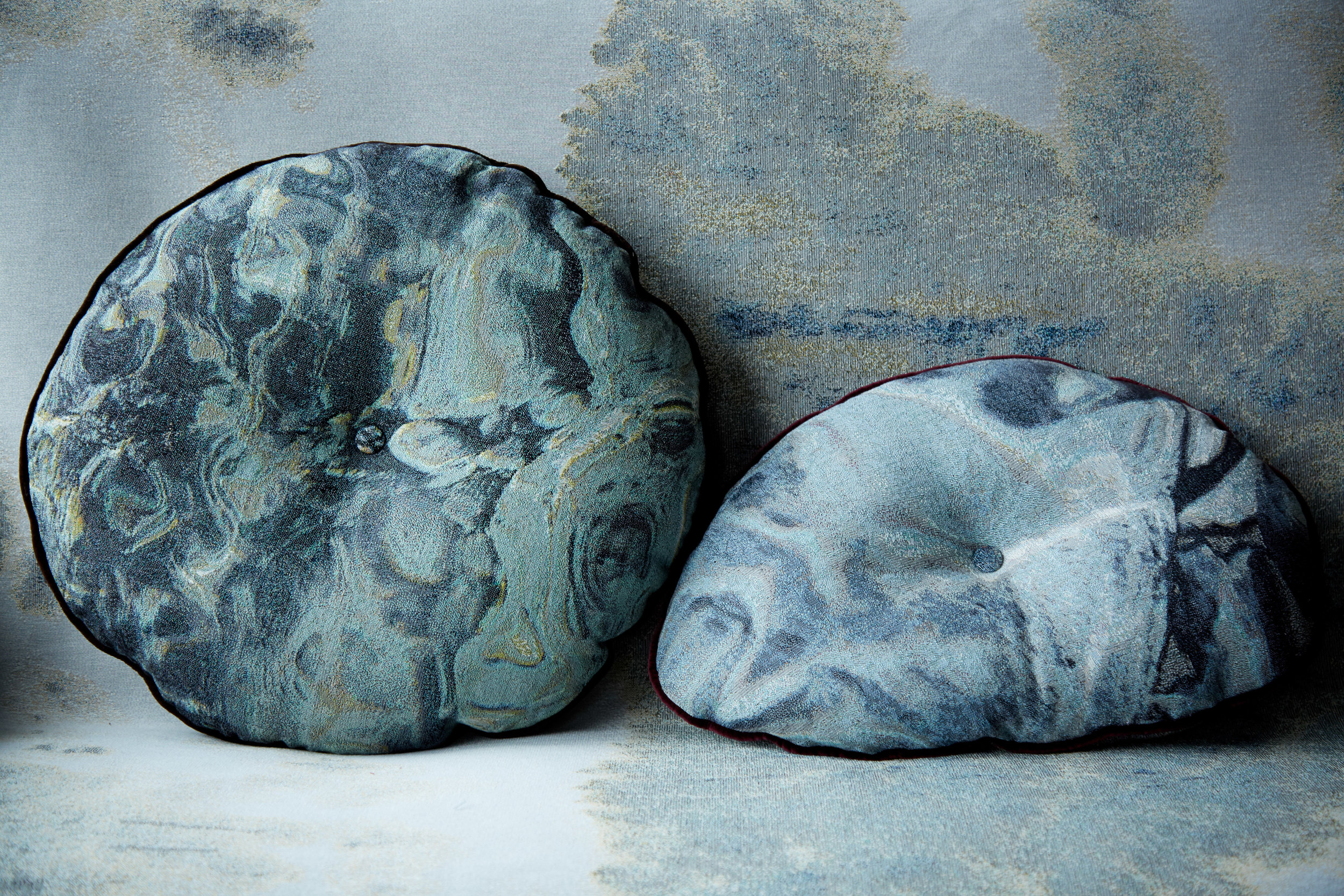 MTS "Almost Circular" tapestry pillow, in Radiant & "Pebble" pillow, in Swirl.