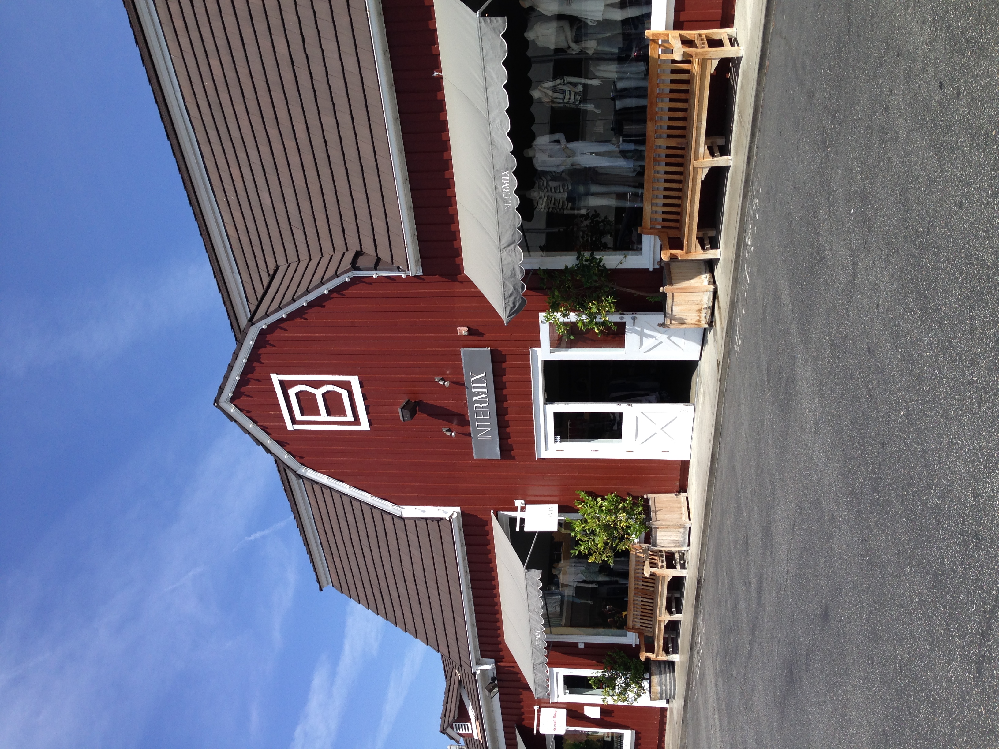 The entrance to the Brentwood Country Mart, a red and white retail barn space that has been in existence since the late 1940's. Filled with a rotation of the best small boutiques, from Calypso to Turpan Home, the homey feel of the space is evident in its steeped-in-charm facade