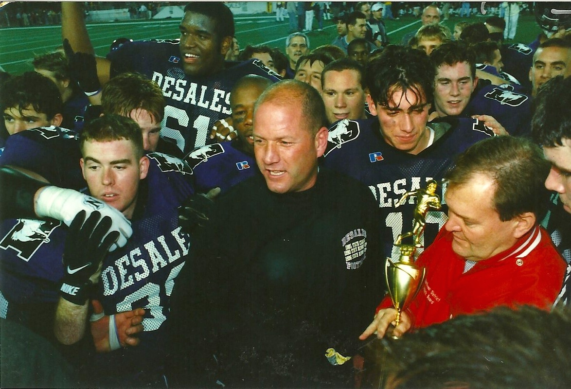 Head Coach Bob Jacoby being presented the championship trophy