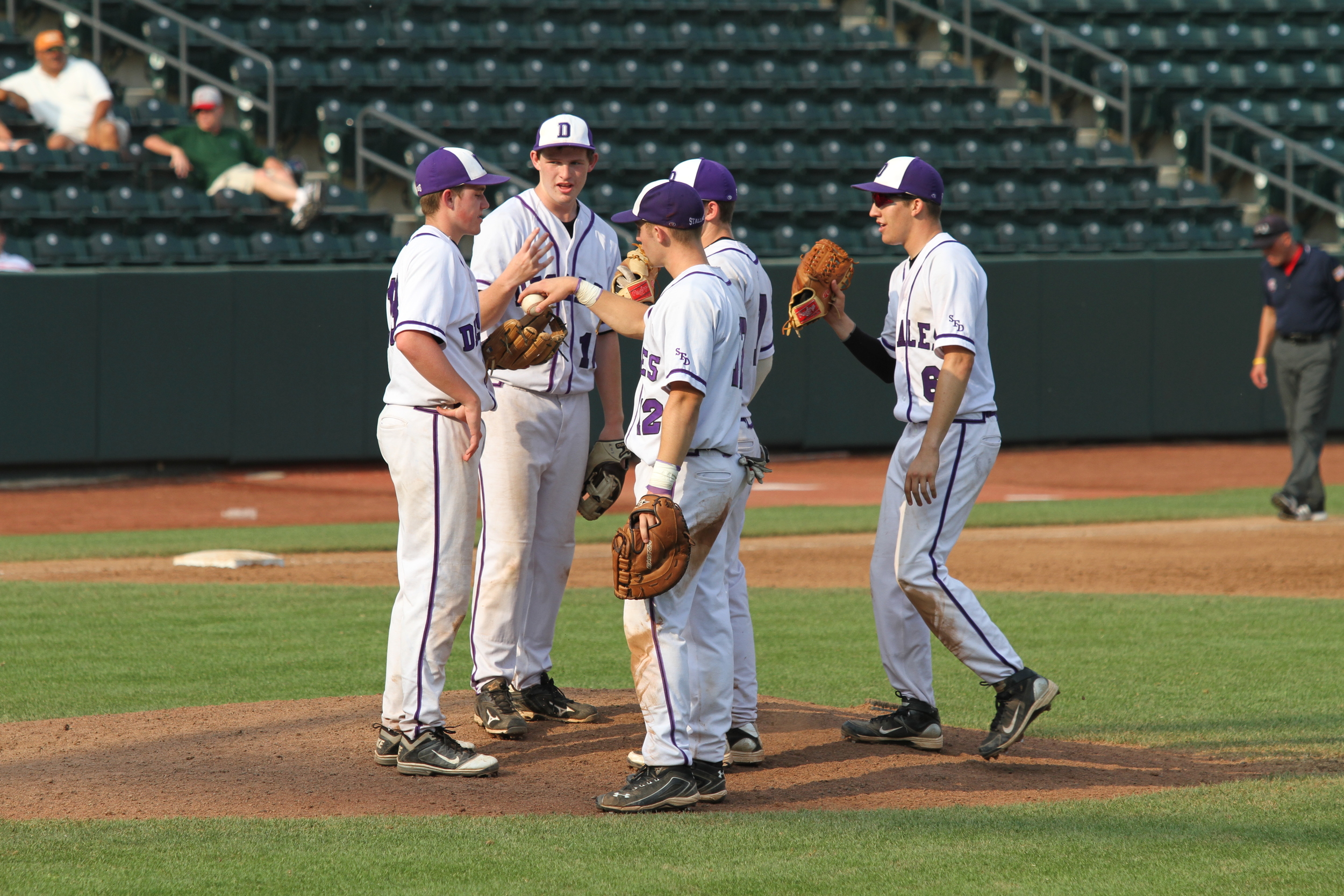 Player meeting at the mound in the title game