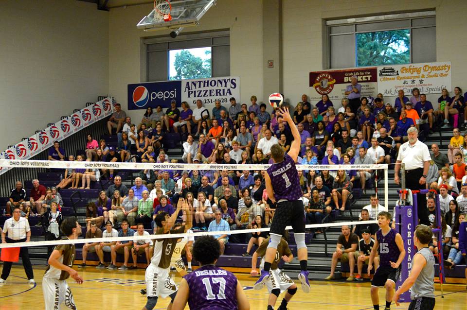 Senior middle hitter Luke Melsop rising up