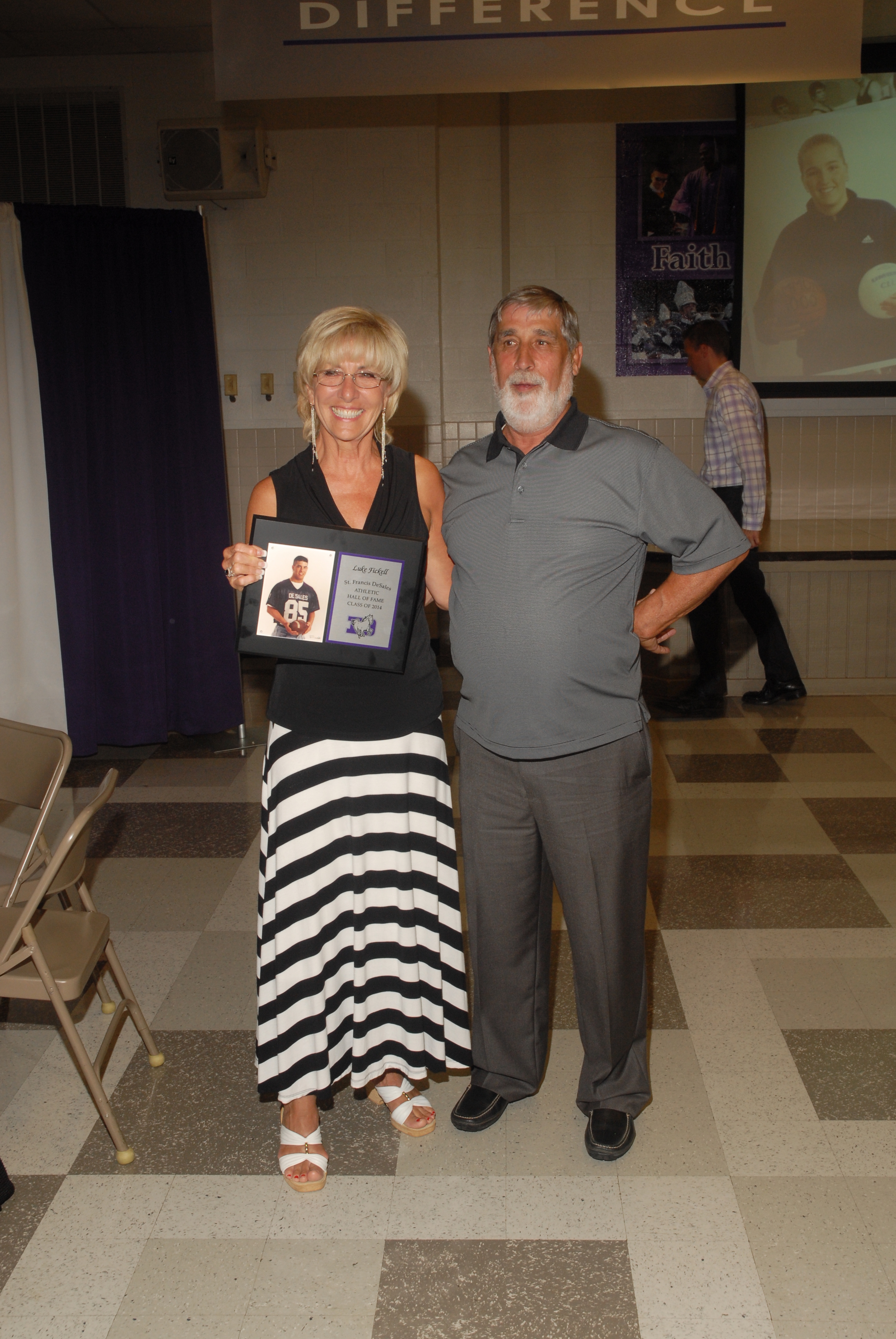 Pat and Sharon Fickell, accepting on behalf of their son Luke