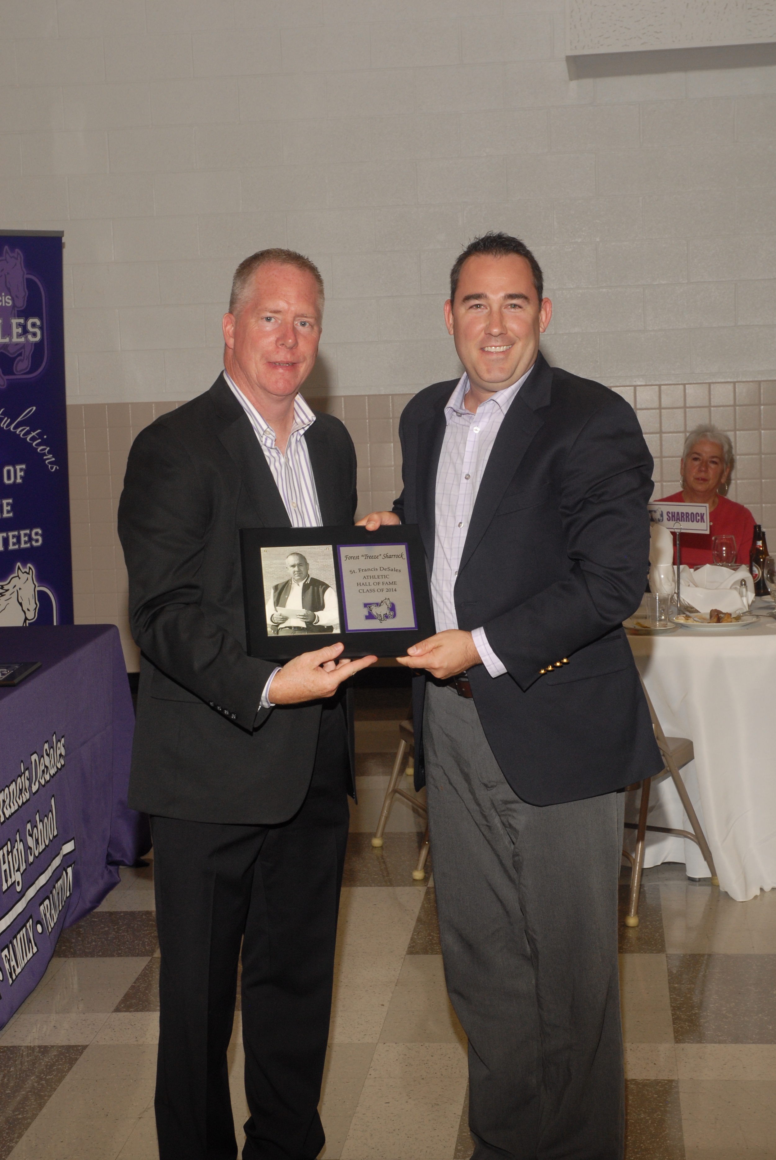 Travis Marter, Forest Sharrock's grandson, with principal Dan Garrick