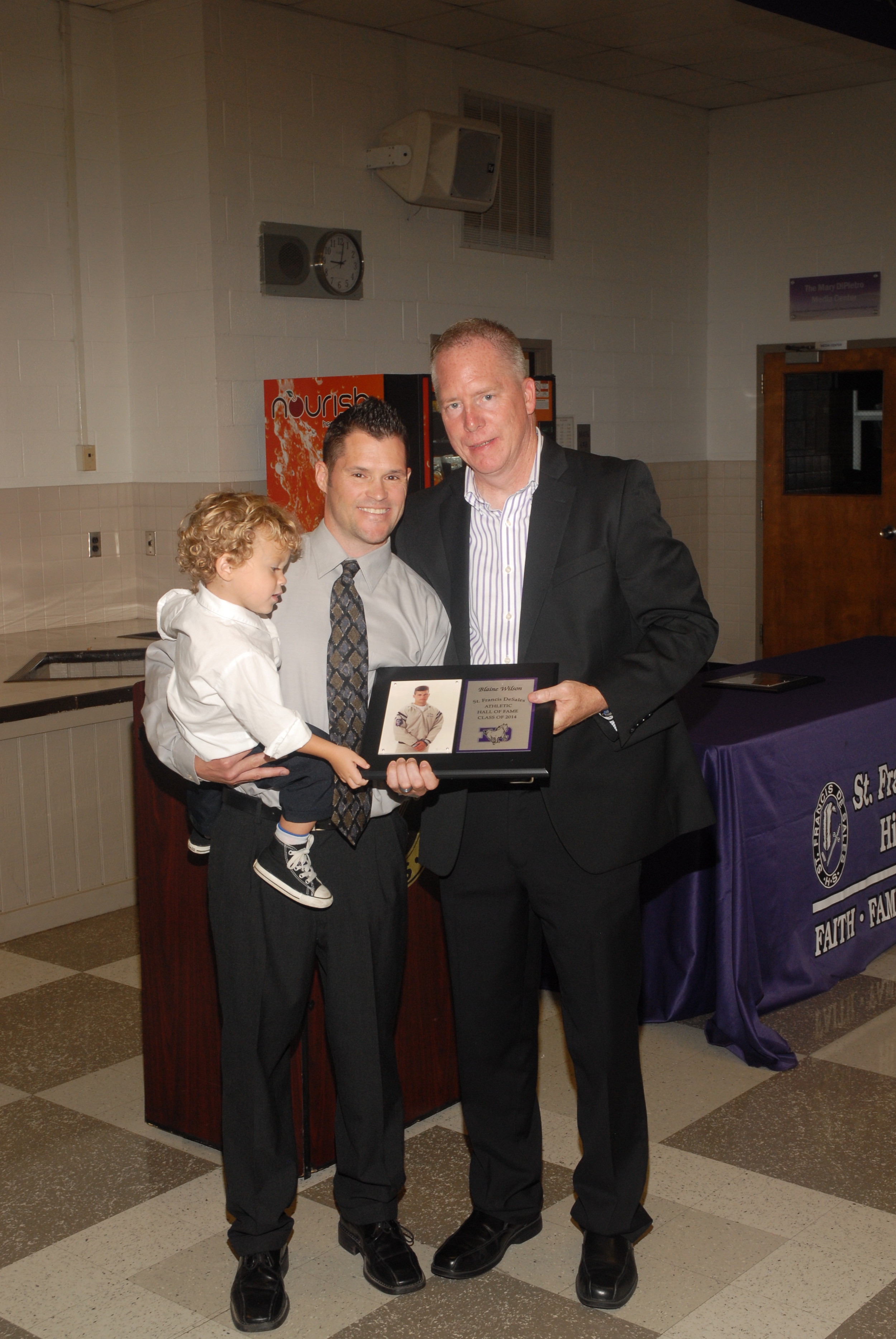 Blaine Wilson, his son and principal Dan Garrick