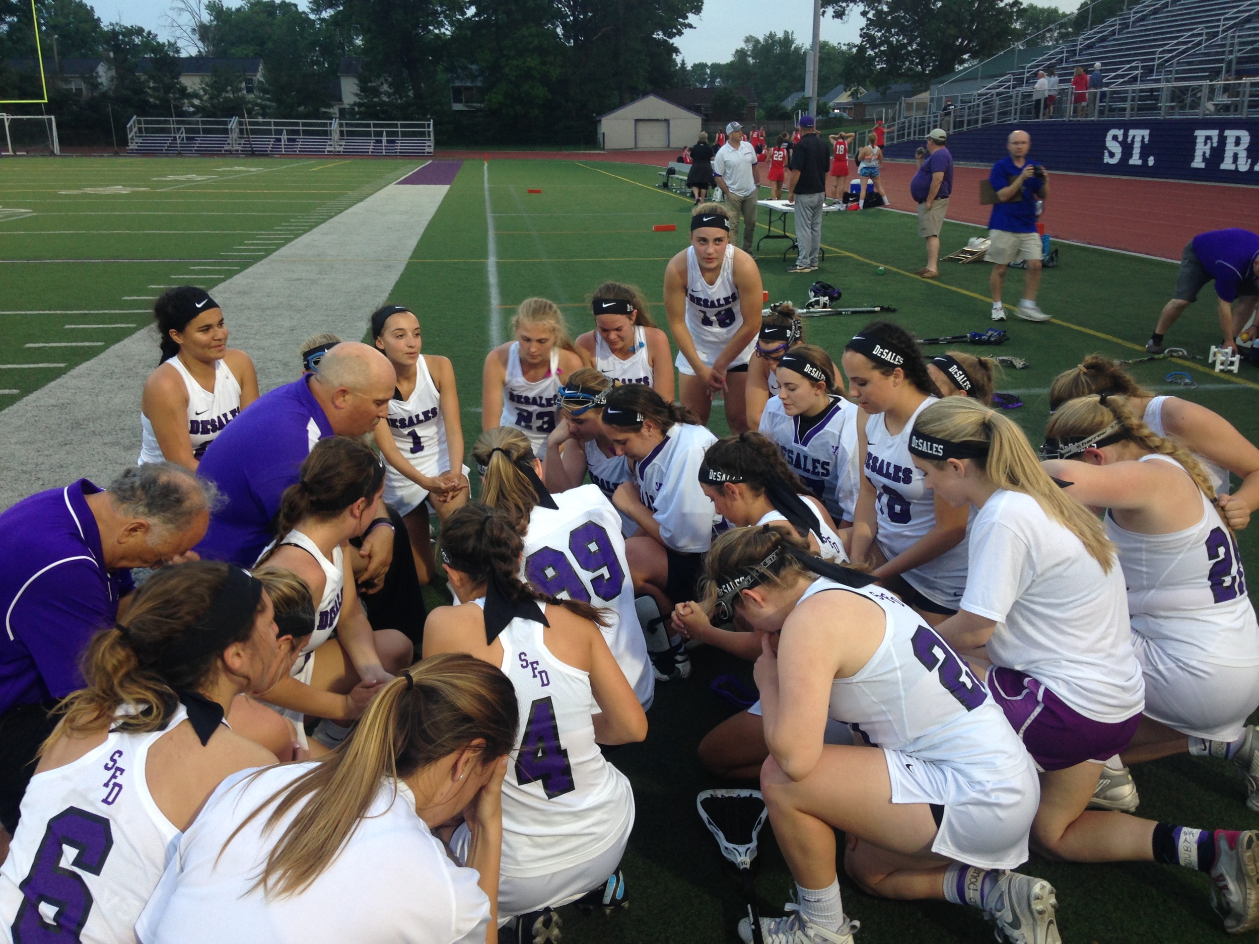 Postgame prayer after capturing the program's first Regional title