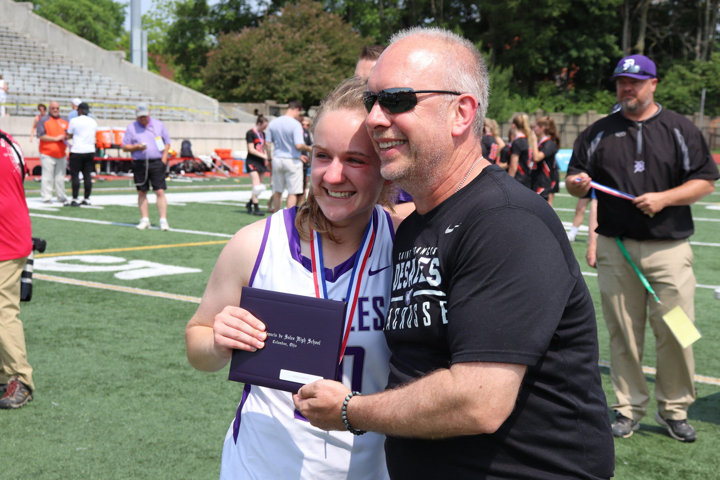 Grace Lensmire poses with her father Jeff, an Assistant Coach