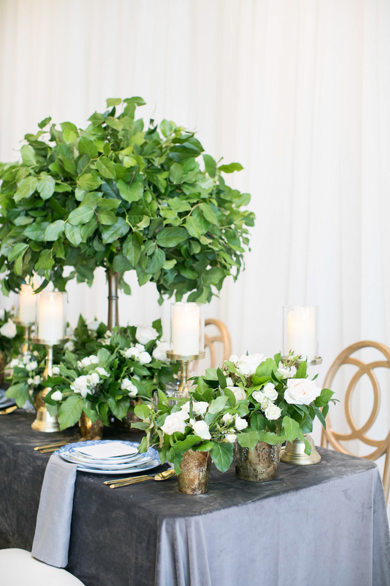 wedding day tablescape with velvet linens and tall greenery