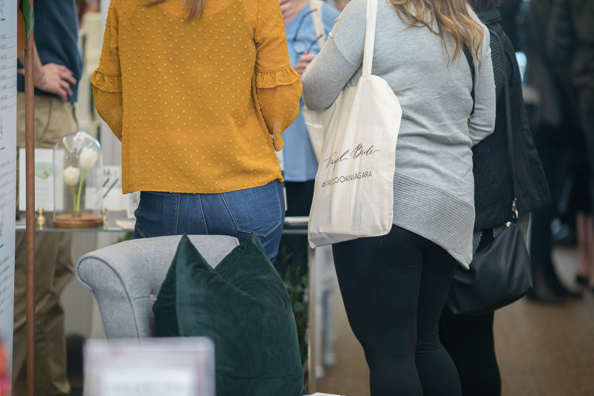 brides with vineyard bride canvas tote bags at the first look autumn wedding show