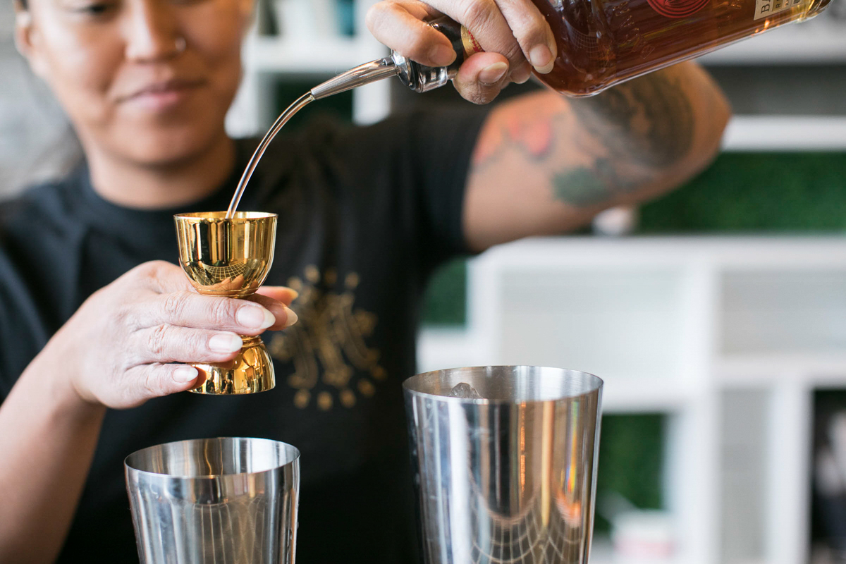custom cocktail being poured and shaken