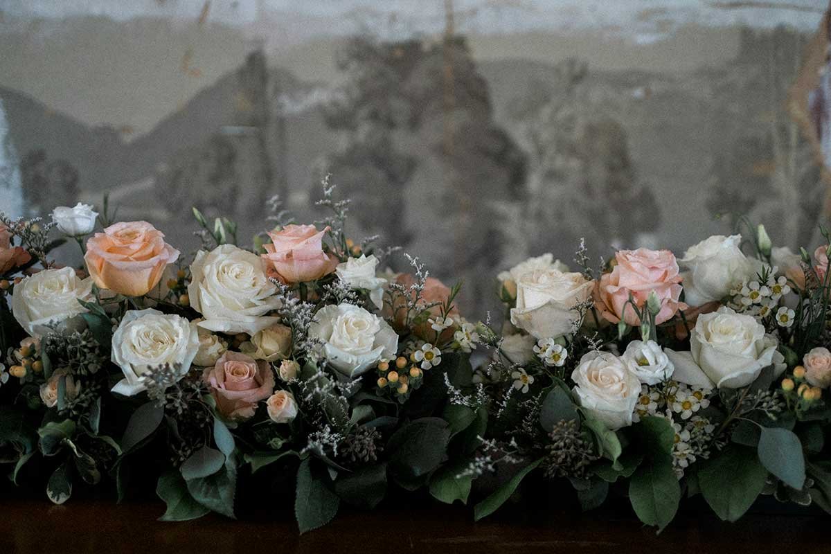  Wedding reception flowers, roses in white and shades of pink. 