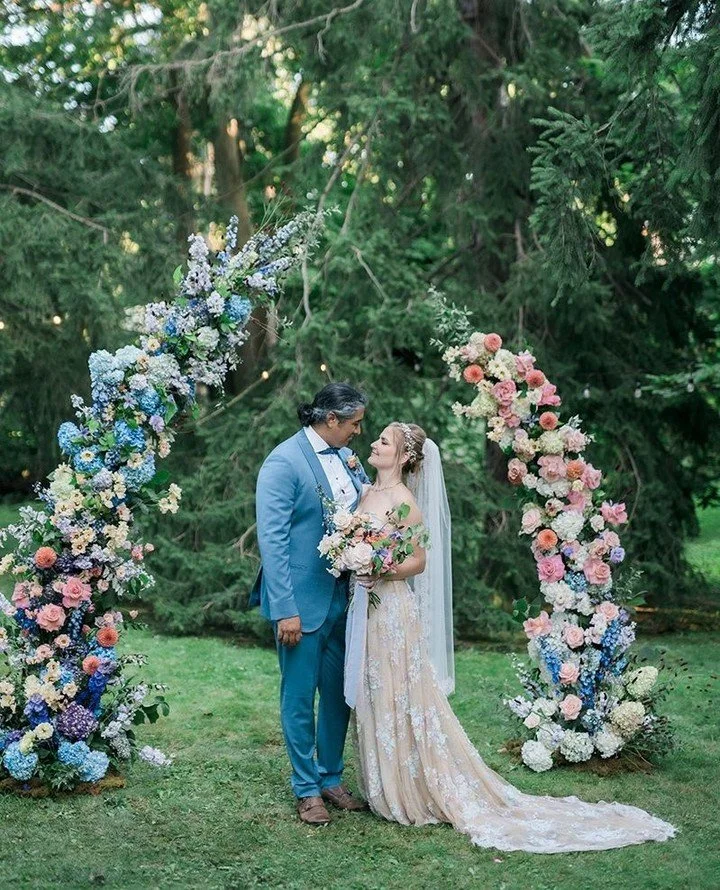 This one feels like stepping into a dream. A whimsical garden wedding filled with soft pastel blooms, an incredible floral ceremony backdrop, and an open-air reception that felt effortlessly romantic from start to finish. One of our favourite details