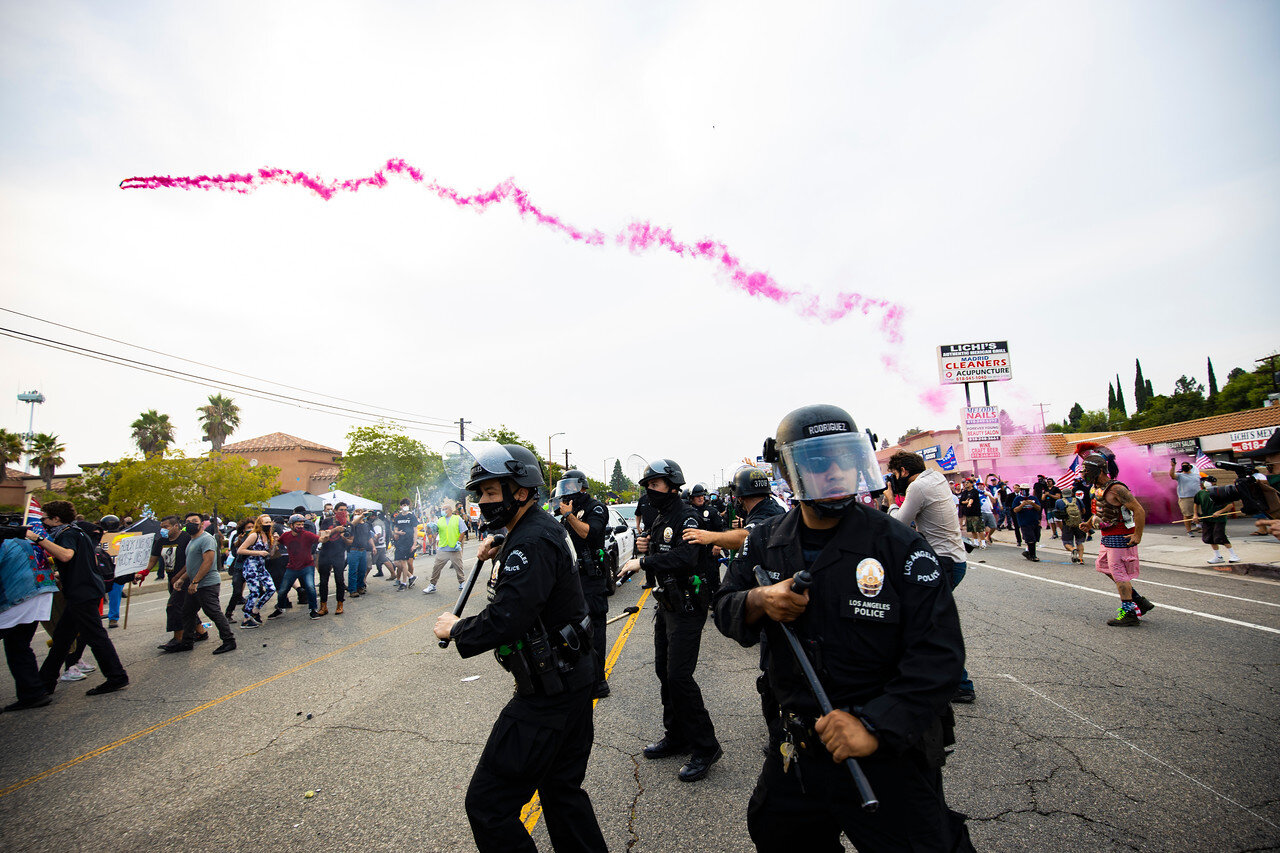  LAPD officers attempt to hold a scrimmage line as supporters of Black Lives Matter and supports of President Trump face off. (Brian Feinzimer) 
