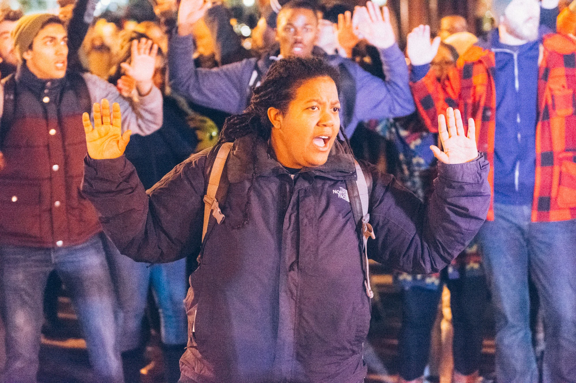 The march stopped right before entering the intersection in the "Hands-up, don't shoot" pose that has become iconic with this movement.