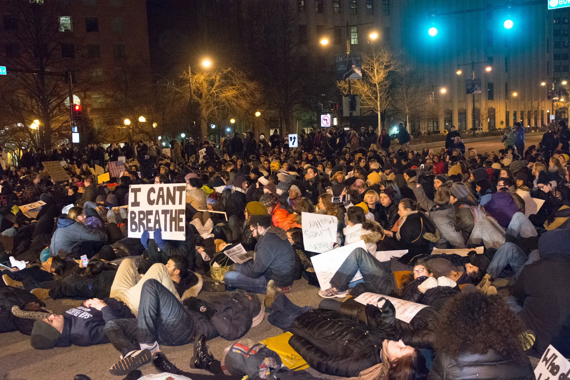 The "die-in" was supposed to last eleven minutes, one minute for each time Eric Garner cried out "I can't breathe" before dying while to NYPD continued to choke him. An ambulance had to get through and within a few seconds the protesters cleared the streets and continued to march.