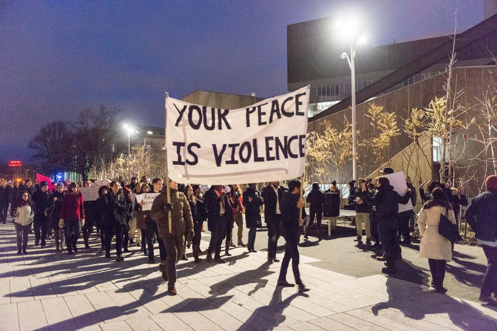 A group of students arriving at the Science Center Plaza in Harvard Square