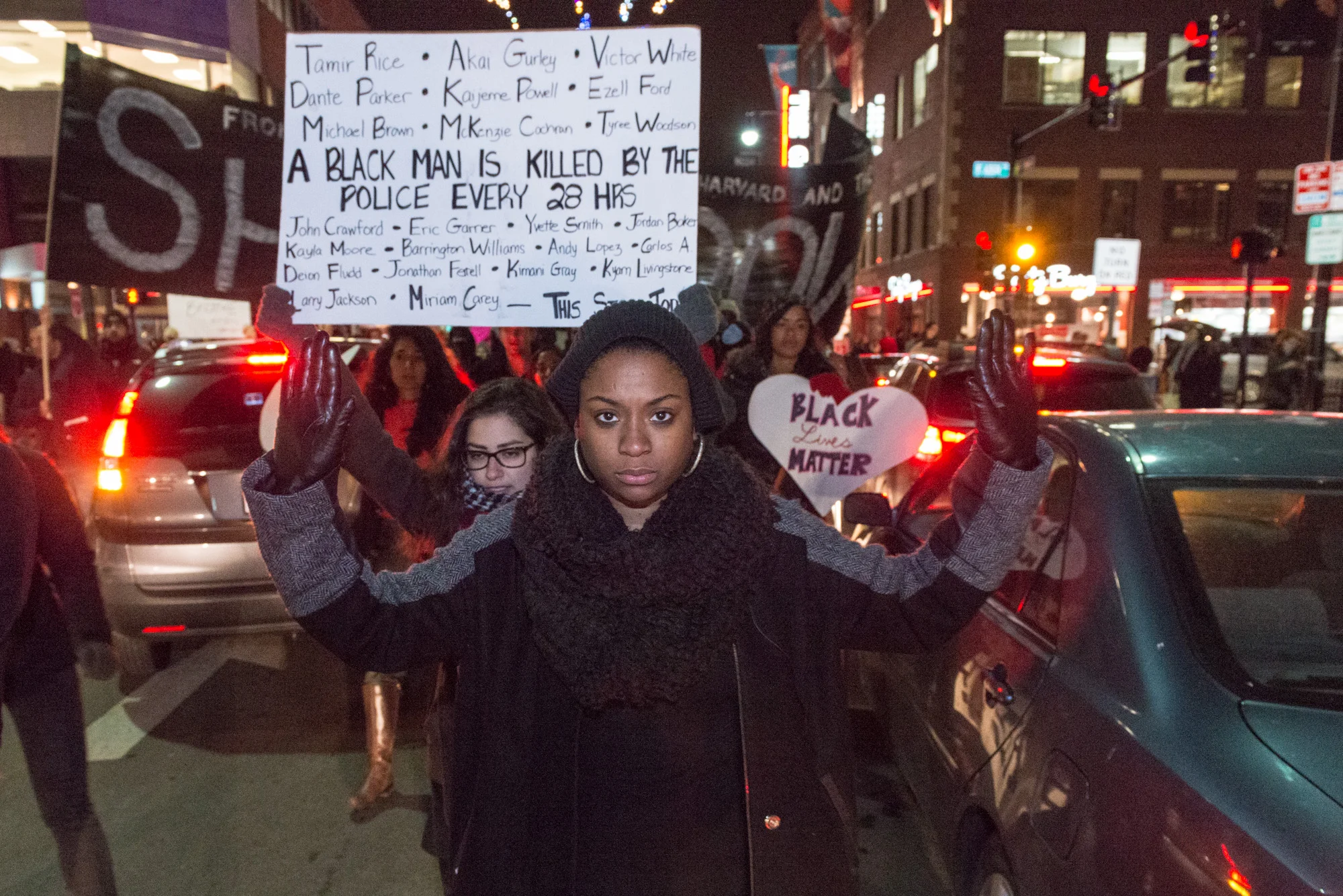 One of the organizers marching 'Hands up'