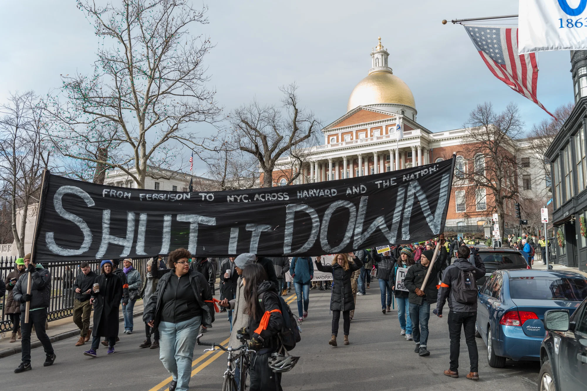 This is the same sign (often held by the same people) as Friday nights Harvard students march