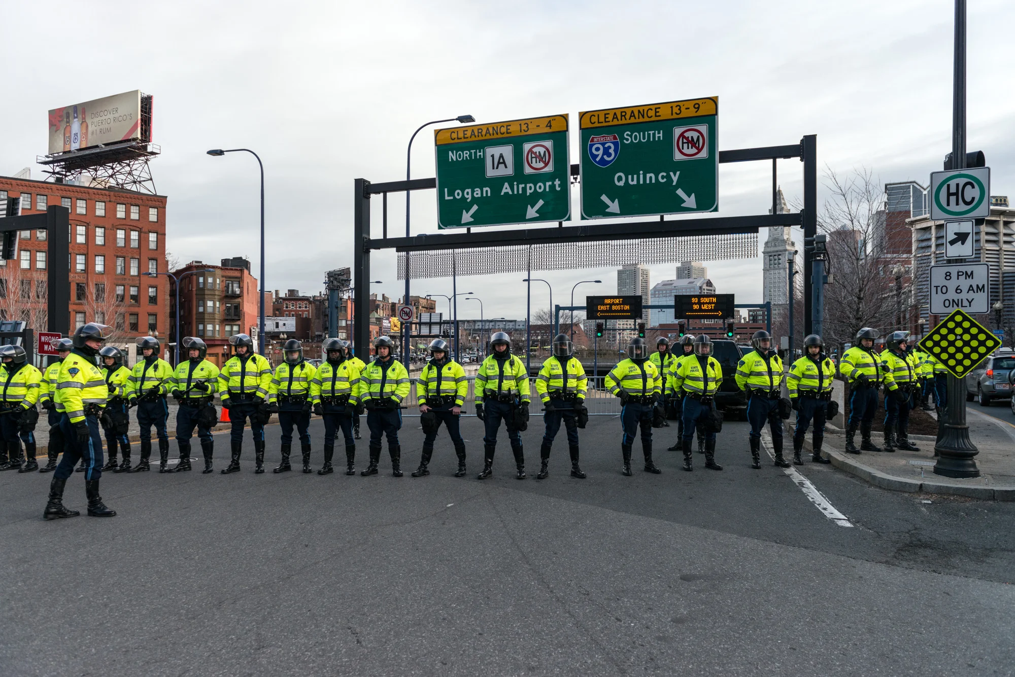 State Troopers with riot helmets blocking both directions of the I-93 connector ramp