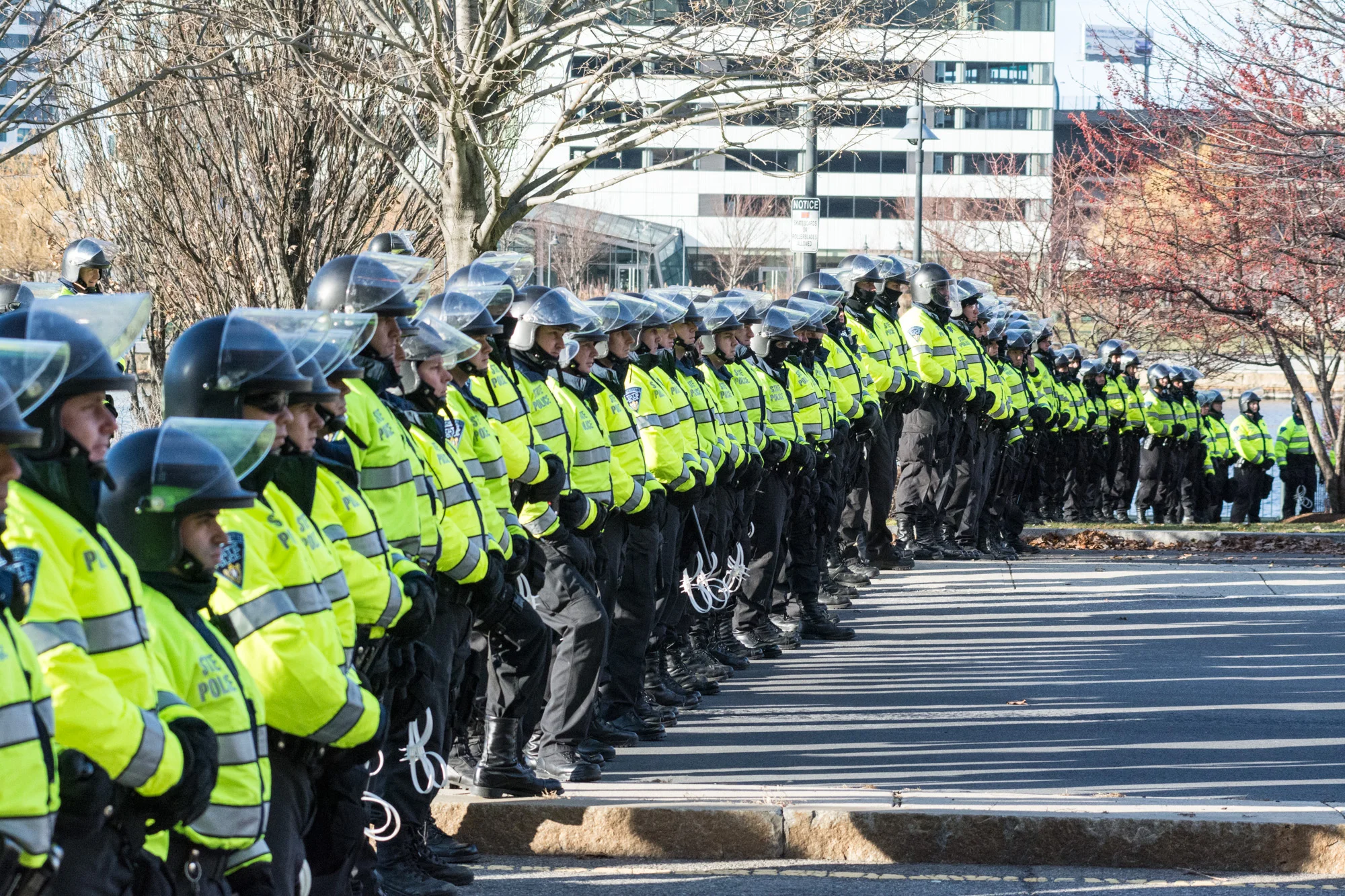 A line of police officers blocked both sides of the street and the adjacent park 