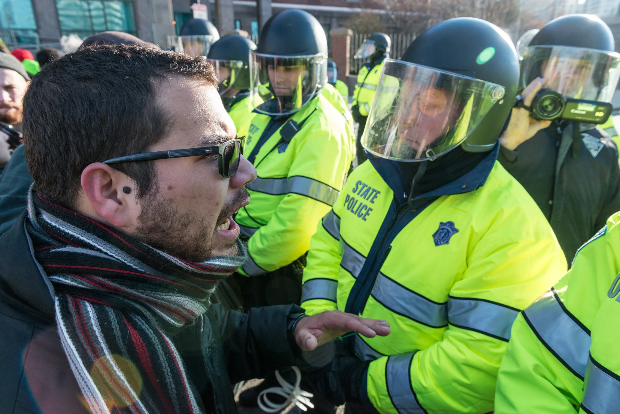 One of the protest organizers trying to talk his way past the officers blocking the street