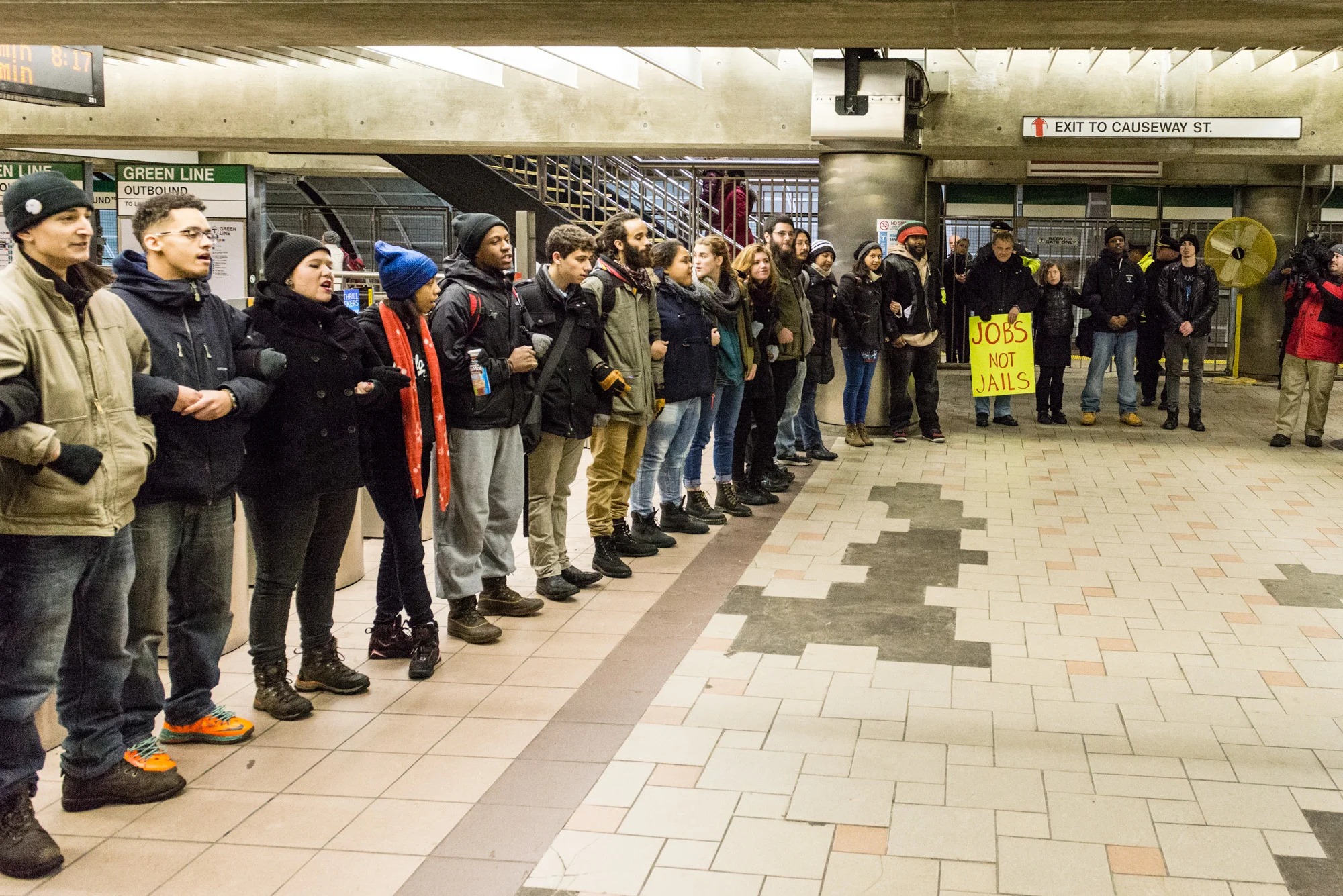 Everyone, arms linked in North Station