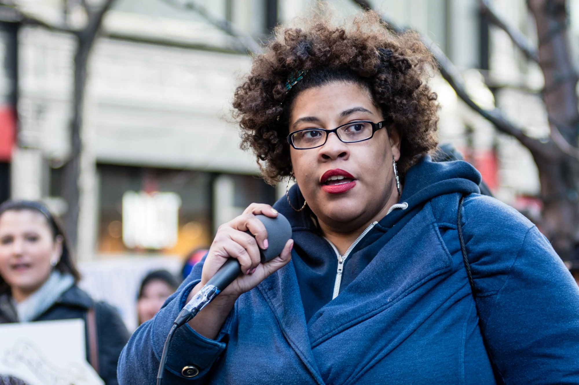 One of the organizers speaking to the crowd before starting to march