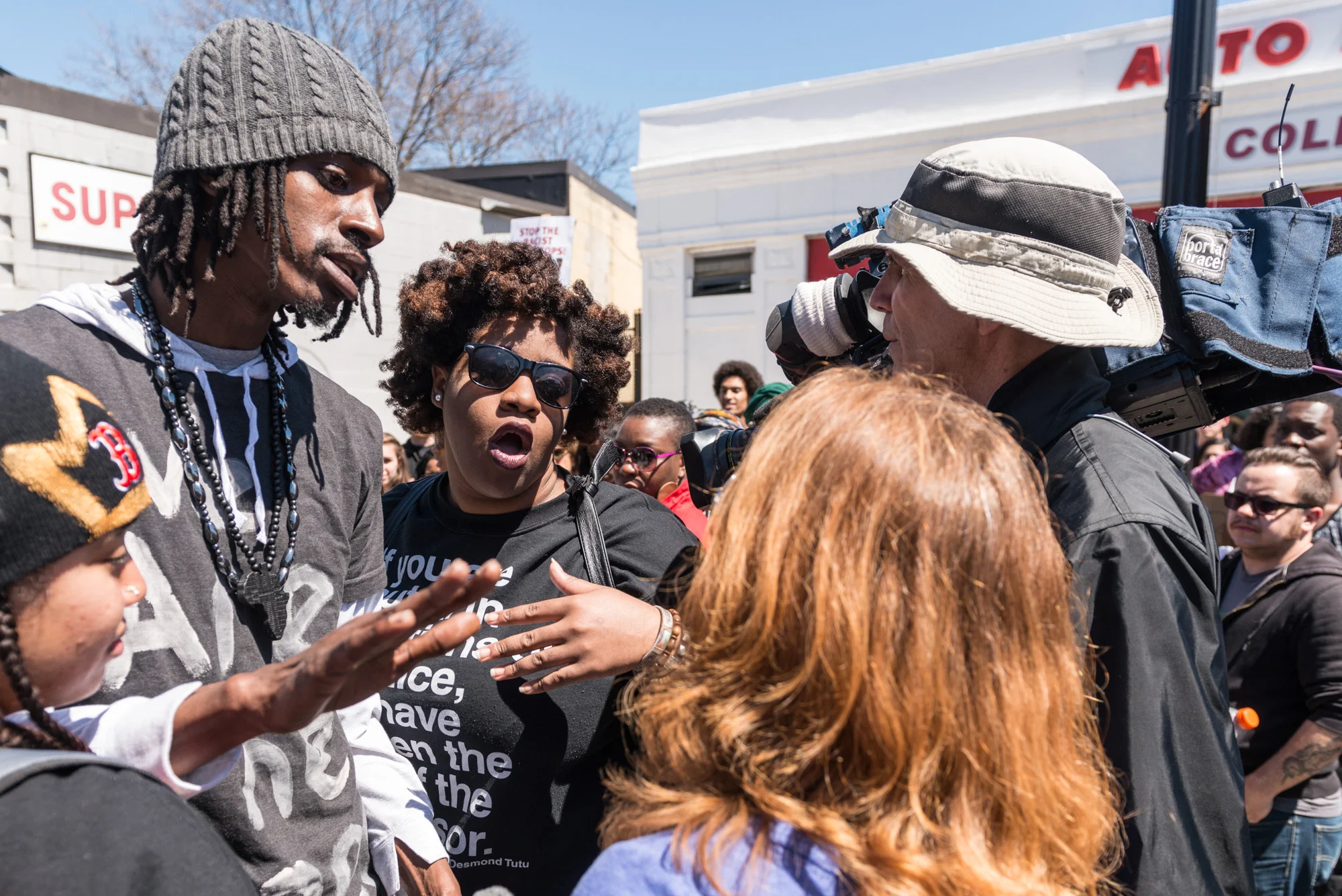 Two of the organizers confronting local media