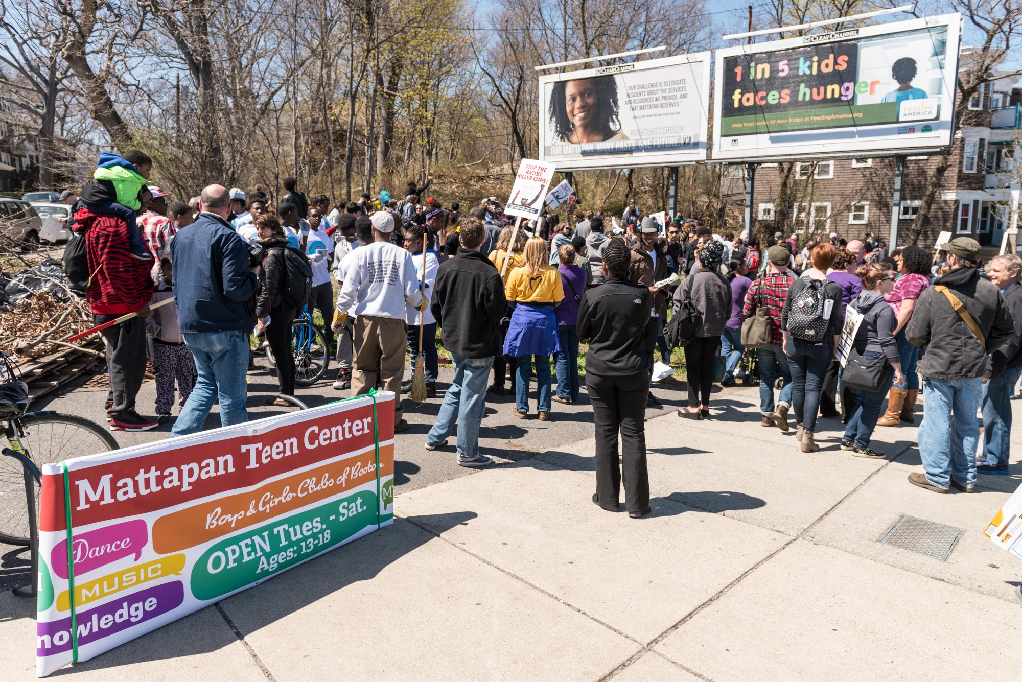 The march stopped to help a local community group clean up a small park
