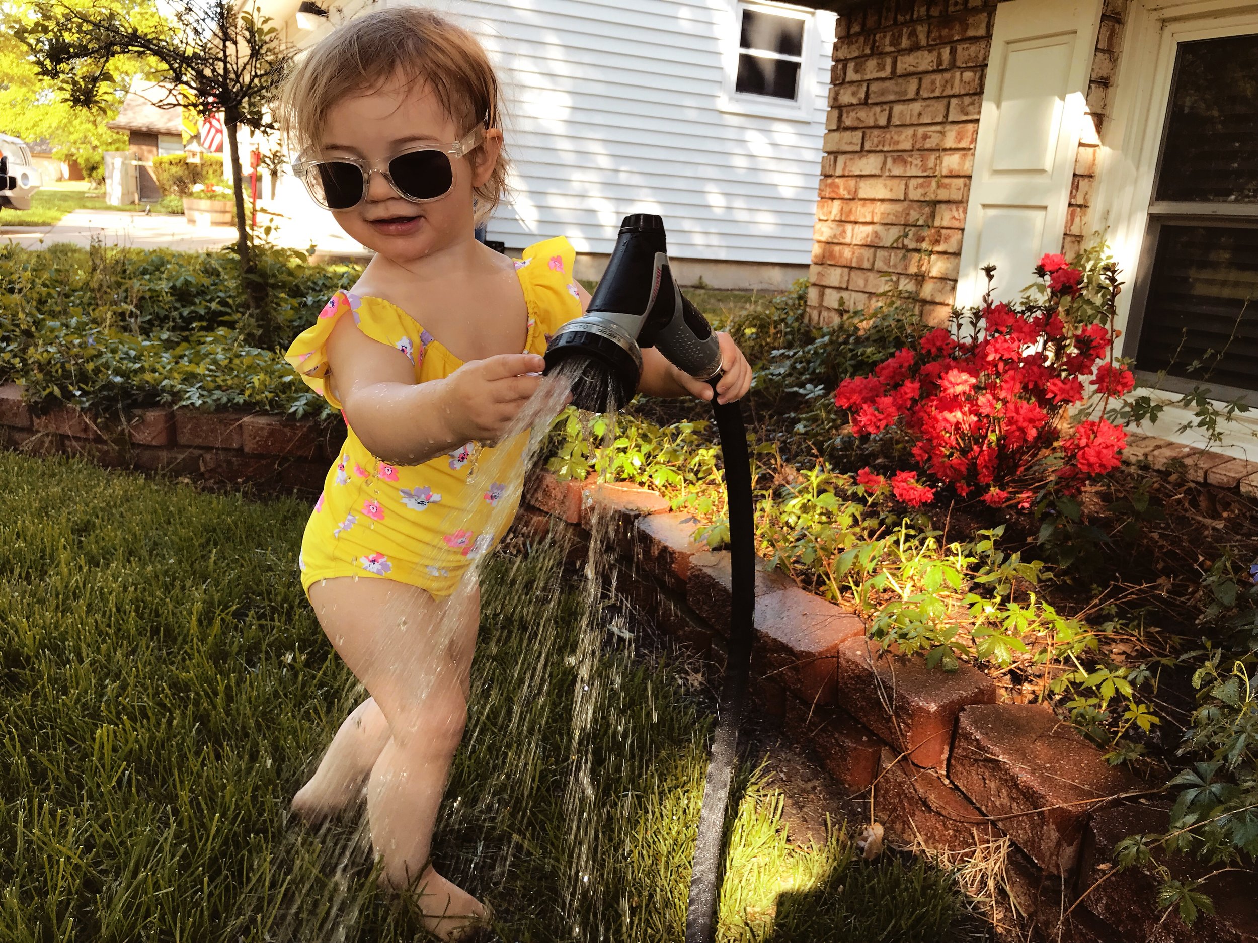 Playing in the hose | MALLORIE OWENS