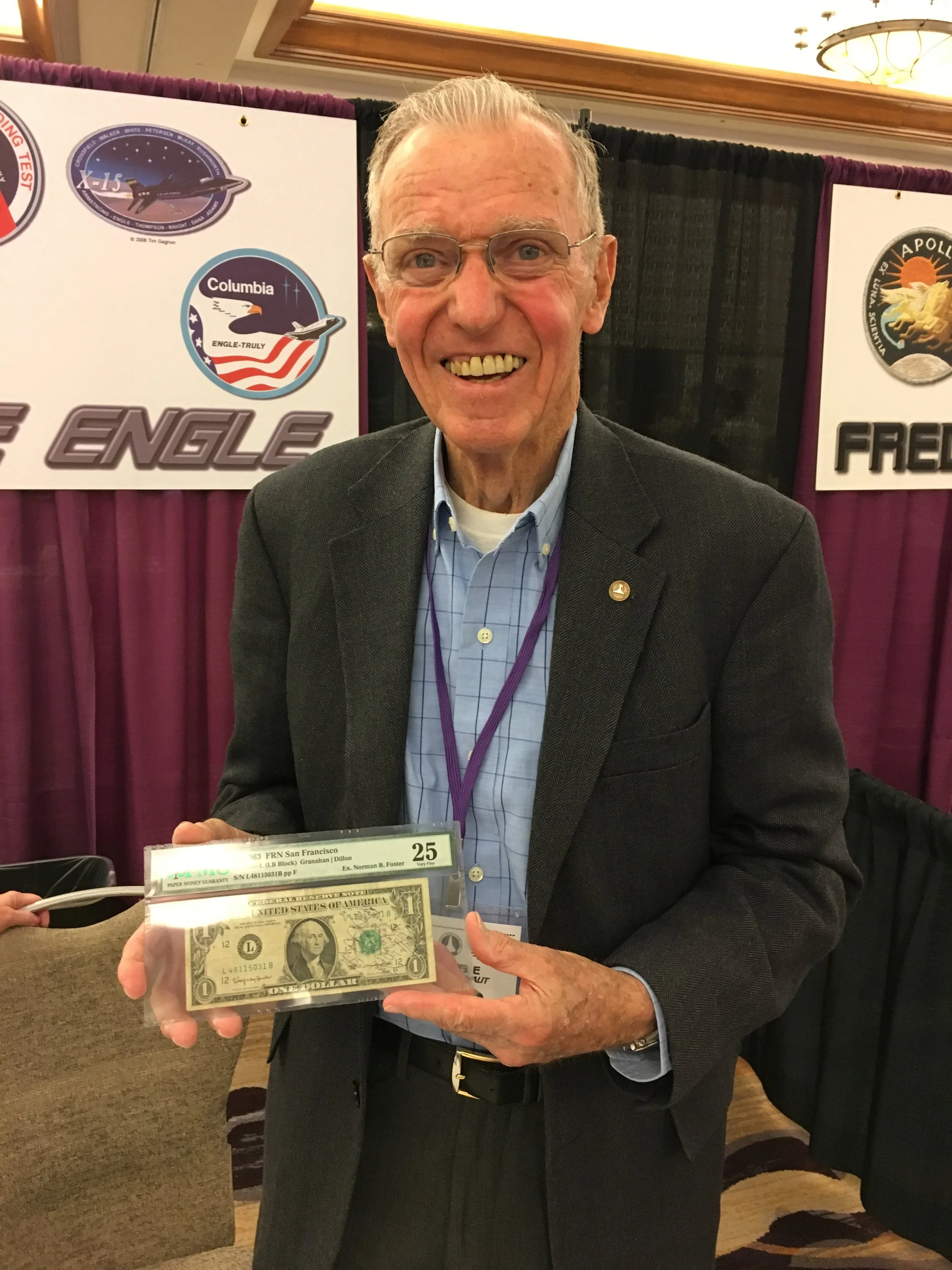 Joe Engle reunited with the $1 bill that flew with him into space on June 29, 1965. 
