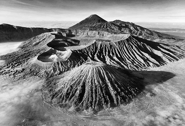 Views over Gunung Bromo and the active crater. Tengger massif, East Java, Indonesia. #bromo #java #indonesia #dronephotography #blackandwhite #sunrise #djimavicair #dronestagram #volcano #photography