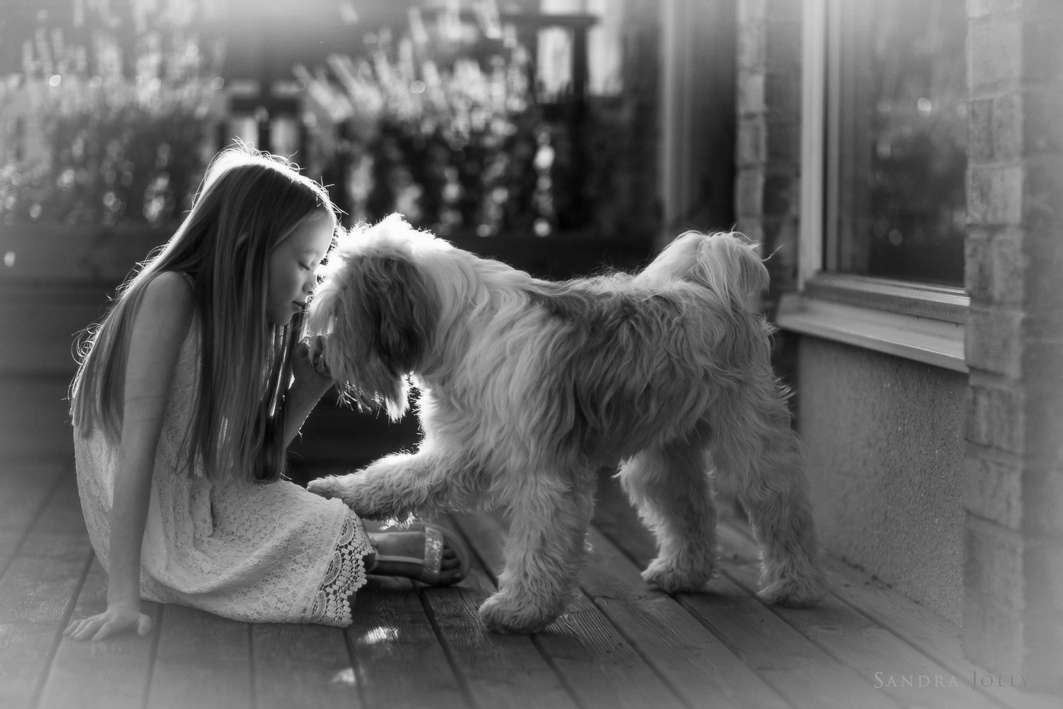 black-and-white-photo-of-girl-and-her-dog-by-barnfotograf-Sandra-Jolly.jpg