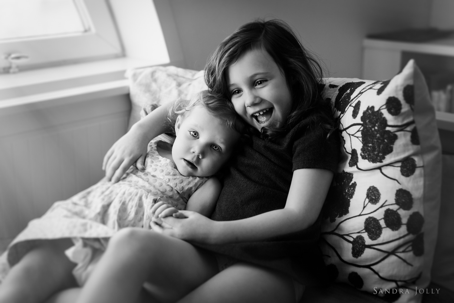 black-and-white-image-of-young-sisters-by-child-photographer-sandra-jolly.jpg