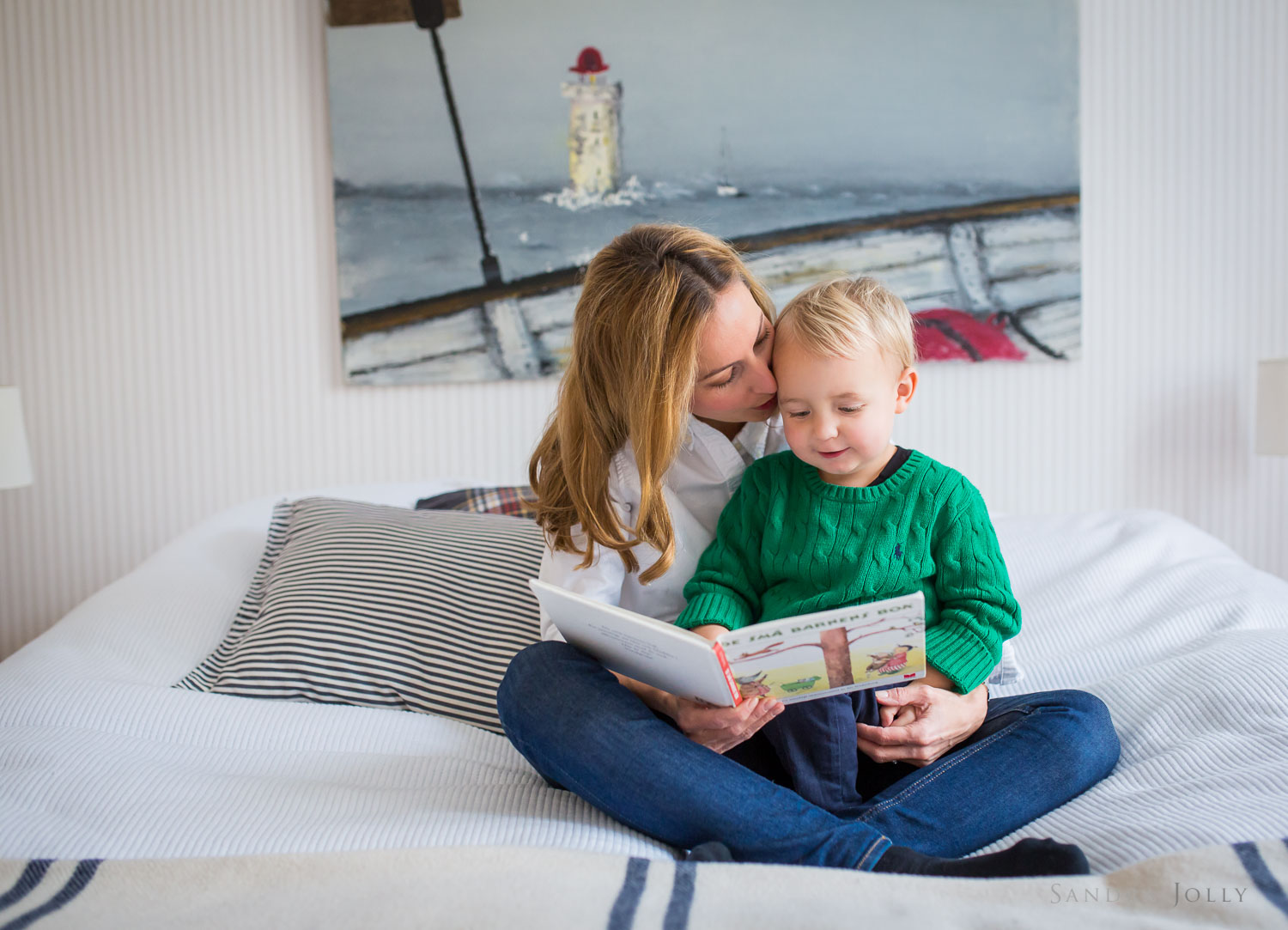 mother-and-son-reading-on-bed-by-Stockholm's-best-family-photographer-Sandra-Jolly.jpg
