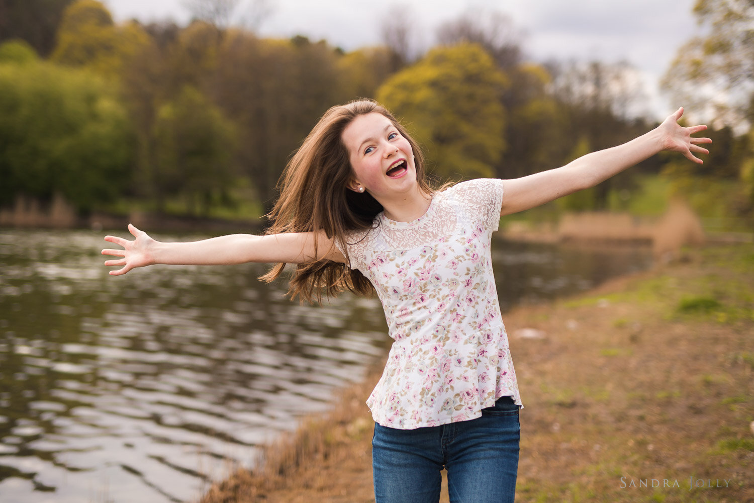 a-photo-of-a-happy-teen-girl-with-arm-out-by-sandra-jolly-photography.jpg