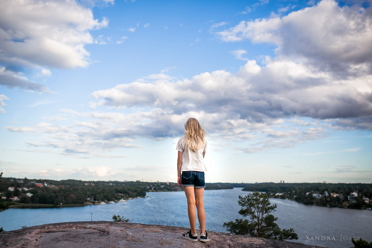 blonde-girl-on-a-cliff-edge-in-stockholm-by-sandra-jolly-photography.jpg