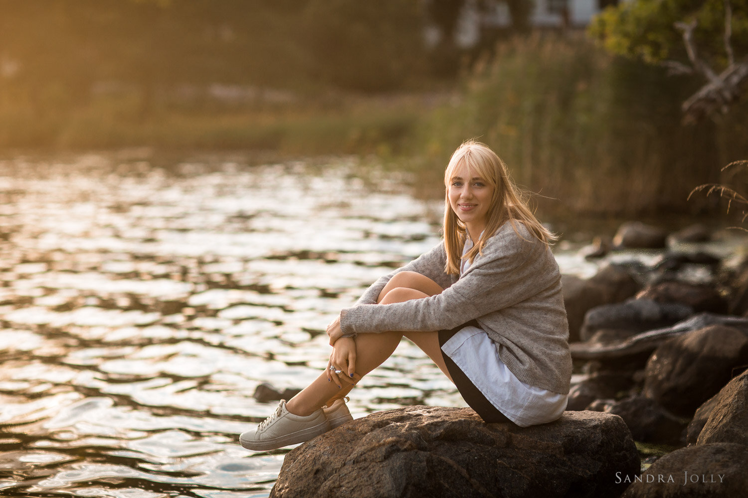 blonde-girl-on-rocks-at-sunset-in-djursholm-by-sandra-jolly.jpg