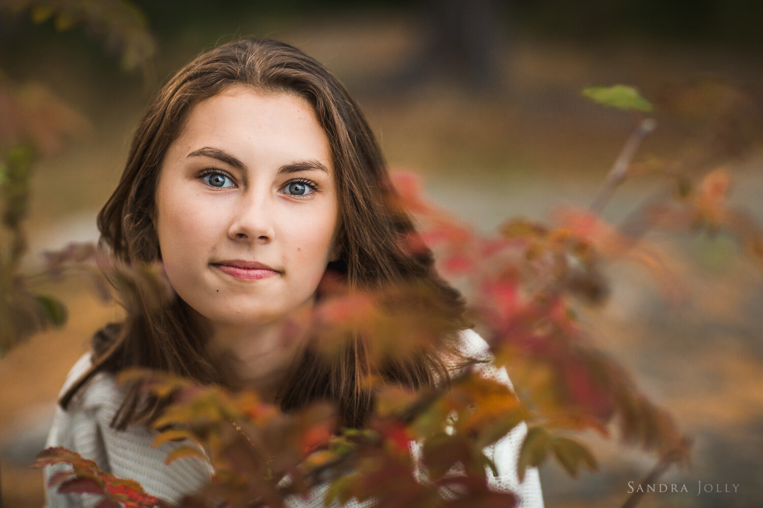 teenage-girl-in-autumn-leaves-by-sandra-jolly-photography.jpg