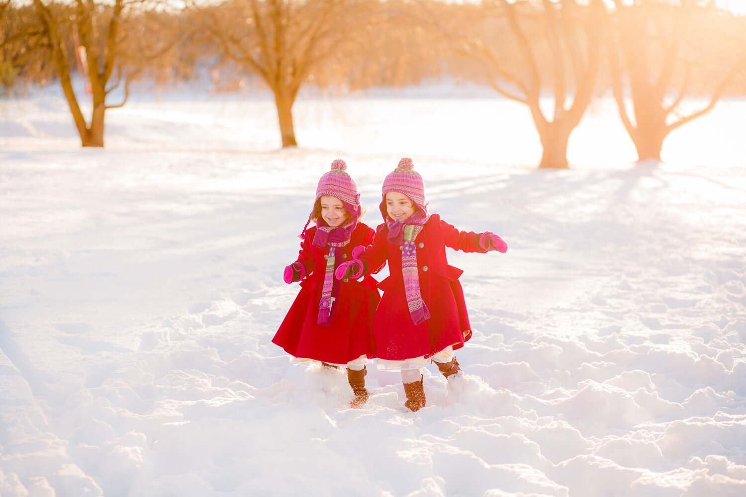 Photo-of-young-girls-running-in-snow-by-Stockholm-family-photographer-Sandra-Jolly.jpg