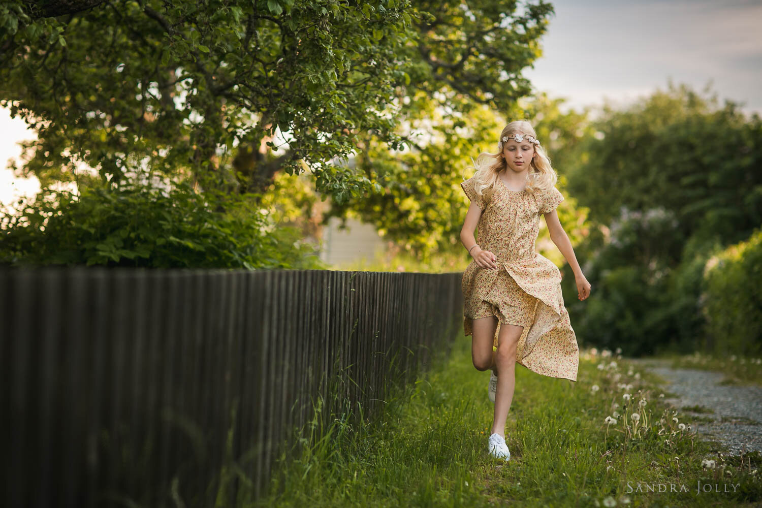 girl-in-yellow-dress-running-by-stockholm-photographer-sandra-jolly.jpg