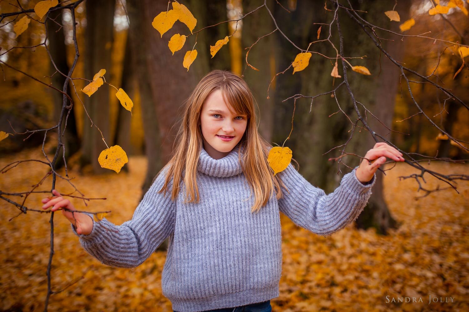 girl-in-autumn-leaves-by-stockholm-photographer-sandra-jolly-photography.jpg