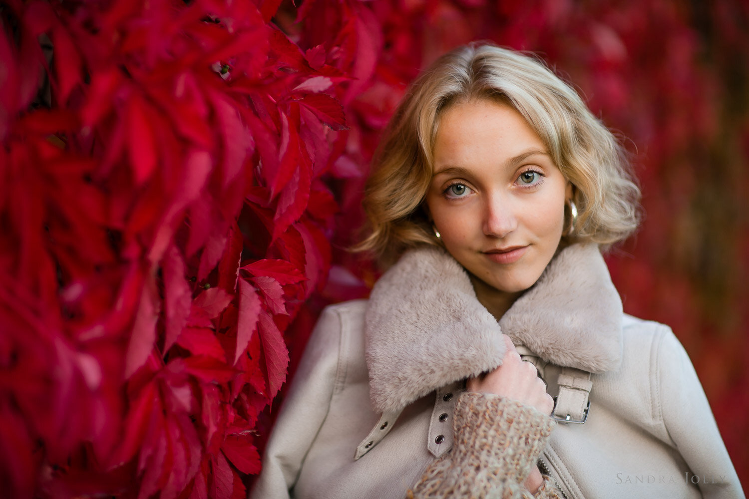 red-autumn-leaves-and-teenage-girl-with-jacket-by-stockholm-portrait-photographer-sandra-jolly-photography.jpg